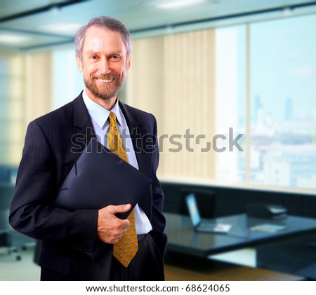 Portrait of a happy senior business man smiling