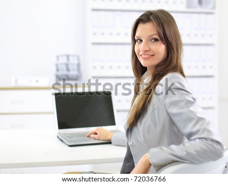 business woman showing blank laptop
