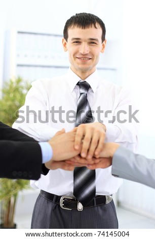 Photo of human hands on top of each other isolated on a white background