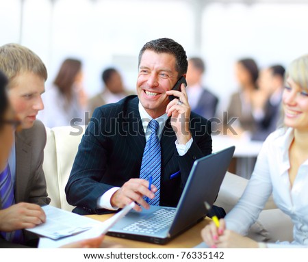 Business meeting - manager discussing work with his colleagues