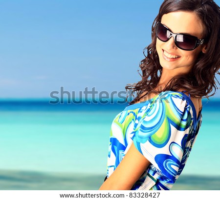 bright picture of lovely brunette woman at the sea