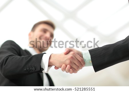 Success concept in business - handshake of business partners
