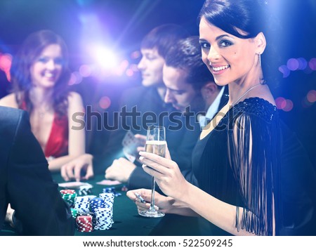 Poker players sitting in casino