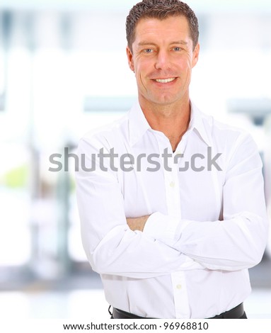 business man looking at camera in the office with copy space