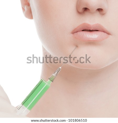 Cosmetic injection in the female face. Lips zone. Isolated on white