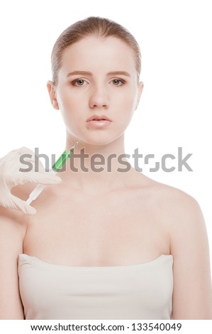 Cosmetic botox injection in the female face. Lips zone. Isolated on white