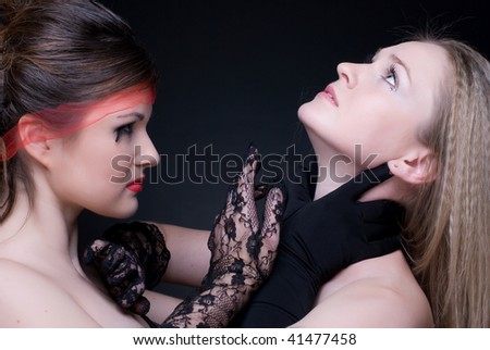 Closeup portrait of two girls: black & white or good & evil