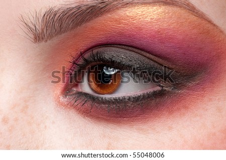 Closeup eyes make-up zone. Purple and golden color. High resolution.