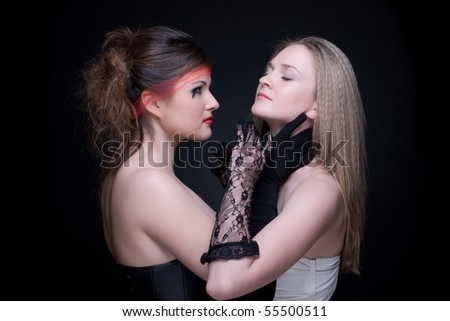 Closeup portrait of two girls: black & white or good & evil