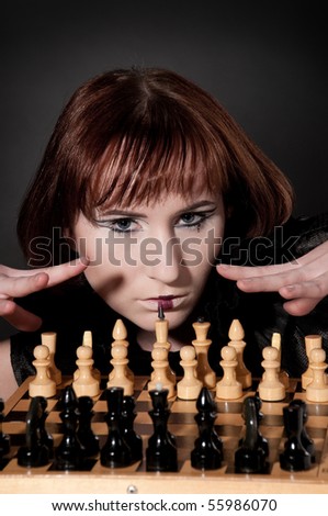 Close-up portrait of beautiful girl in chess queen image and makeup