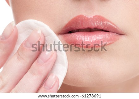 Close-up face of beauty young woman applying face foundation by sponge