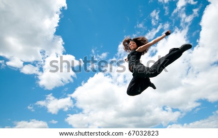 High jum. Flying woman over sky