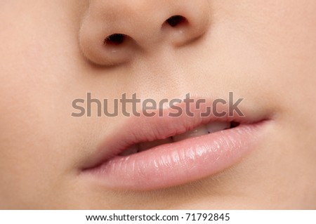 Closeup shoot of young beautiful girl with perfect skin: make-up mouth zone. Lips.