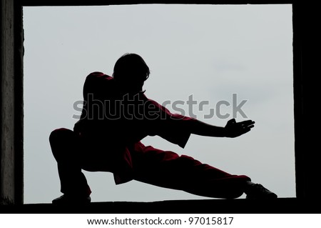 Shaolin warriors wushoo man silhouette practice martial art outdoor. Kung fu