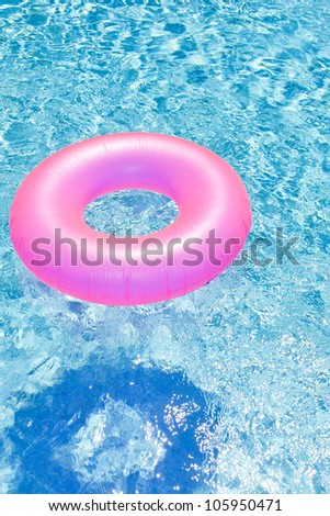 pink rubber ring in swimming pool