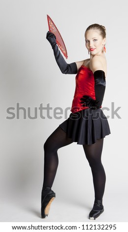 ballet dancer holding a fan