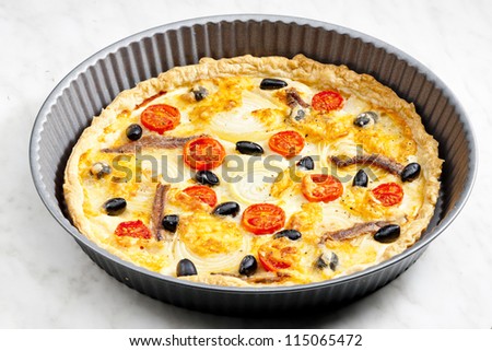 cake with anchovies, cherry tomatoes and black olives