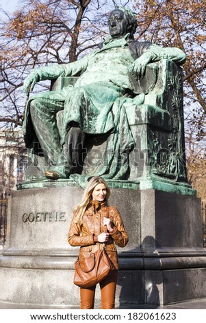 woman standing by Johann Wolfgang Goethe\'s statue, Vienna, Austria
