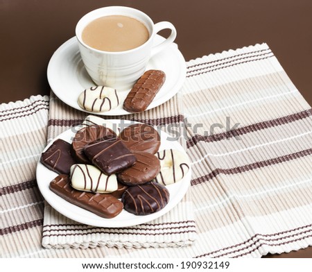 cup of coffee with chocolete biscuits