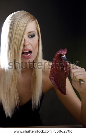 portrait of woman with raw meat