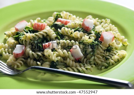 pasta fussili with crab sticks and spinach