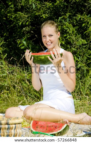 woman with melon at a picnic