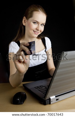businesswoman with a notebook and payment card