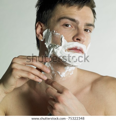portrait of shaving man