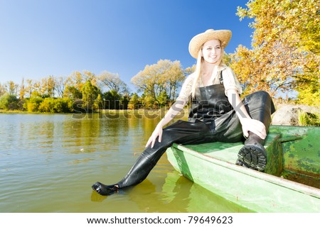 fisher woman sitting on boat