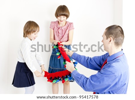 father playing with his daughters