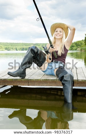 fishing woman sitting on pier - Stock Image - Everypixel
