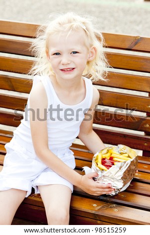little girl eating chips