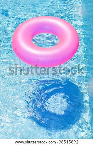 pink rubber ring in swimming pool