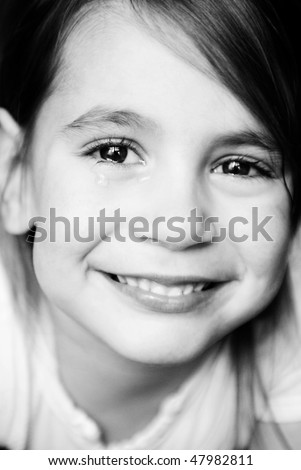 little girl smiling and crying