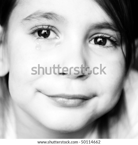 little girl smiling and crying