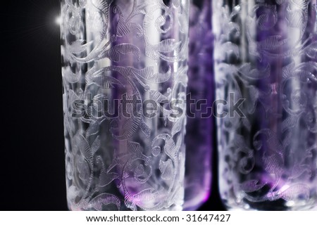 three crystal glasses with engravings