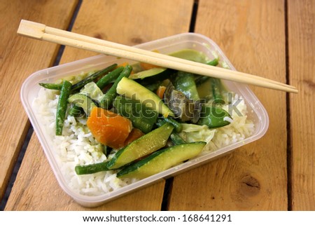 Vegetarian Thai Food  takeaway with rice, mushrooms, courgette, carrots