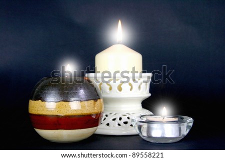 Three candles with very bright flames