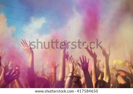 Celebrants dancing during the color Holi Festival . Party, Social Event, Holi, Colors, Multi Colored, Group Of People