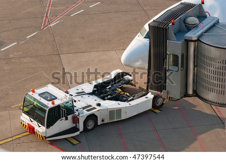 Airport. Jet and towing truck.