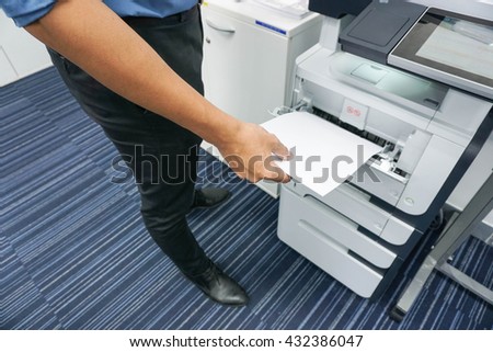 A man is printing document / copy a document