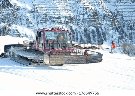 LECH, AUSTRIA - JAN 6, 2014, A Snowcat is preparing a ski slope at the famous ski resort Lech am Arlberg in Austria