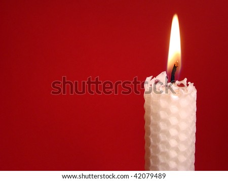 White Beeswax Candle With Red Background