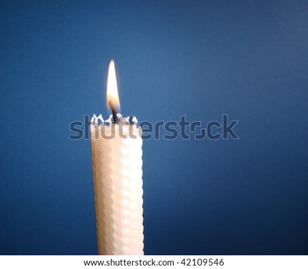 White Beeswax Candle With Blue Background