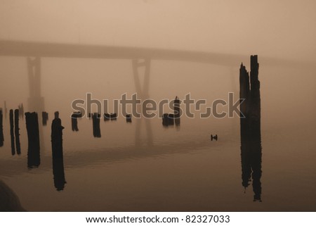 Extreme Fog. A bridge is seen through very dense fog.