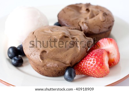 stock photo : chocolate muffins served with ice cream and fruits on the 