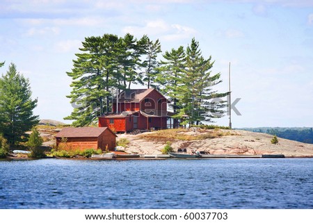 wooden cottage on the lake
