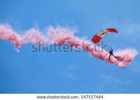 BAGOTVILLE, QUEBEC/CANADA  - JUNE 22: Bagotville Airshow. The Canadian Forces Skyhawks Parachute Team doing figures with smoke. in Bagotville, Quebec, Canada on June 22, 2013.