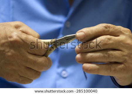 Hands of elderly man, working hands.