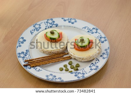 plate of rice cakes tomatoes cheese end salty sticks